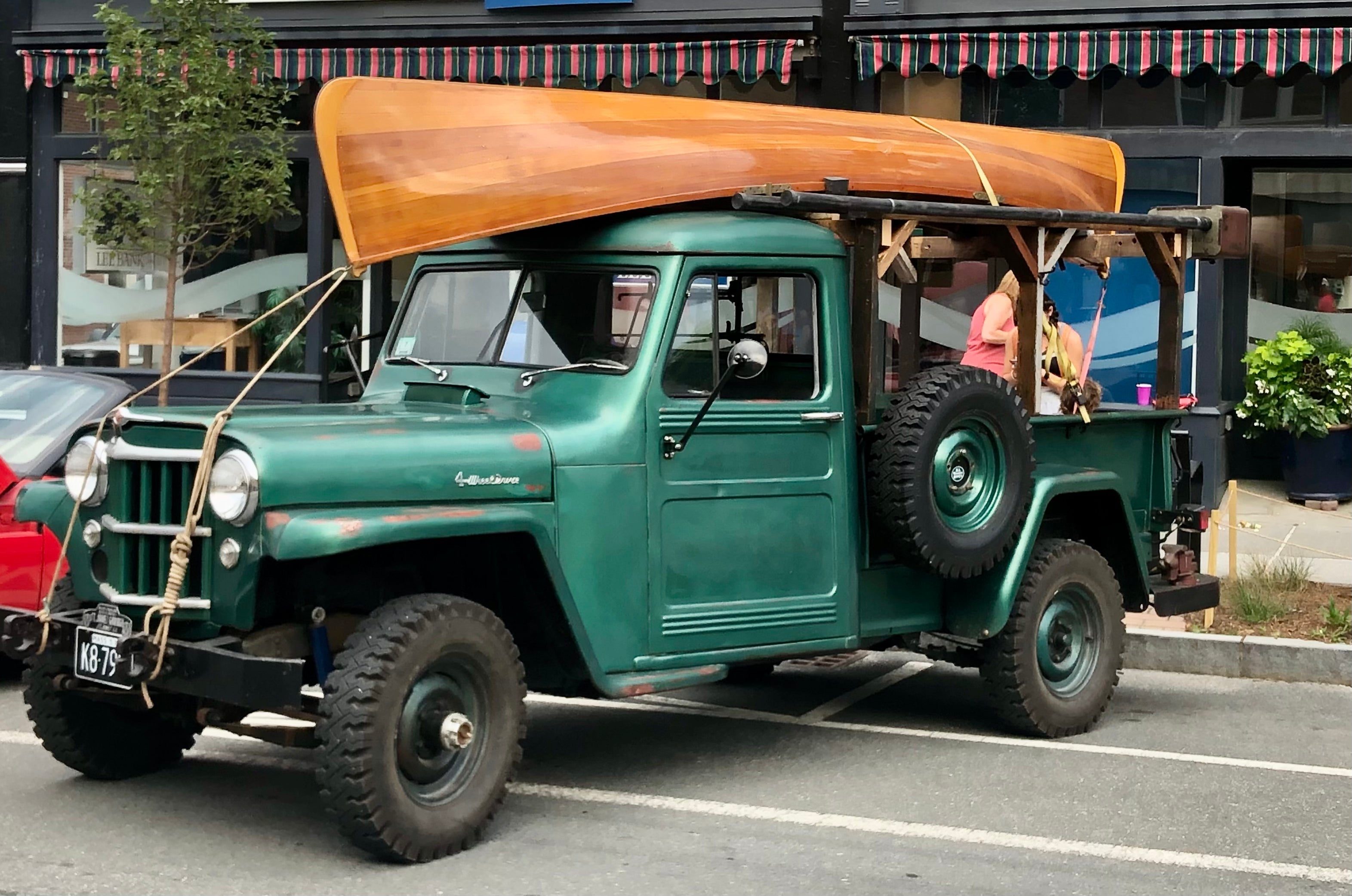 Old vintage truck with wooden canoe on top