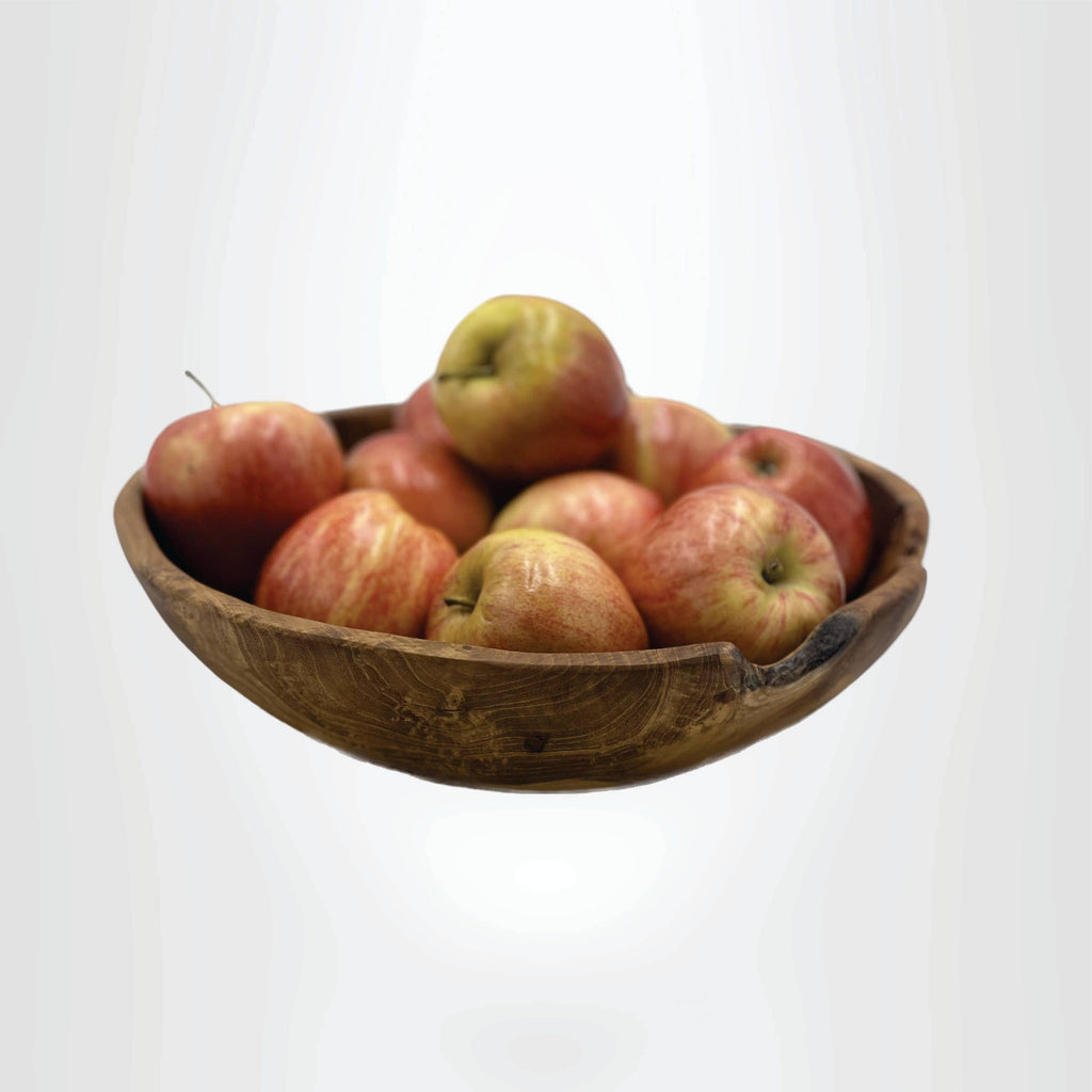 A rustic wooden bowl filled with red and yellow apples, shown against a plain light gray background.