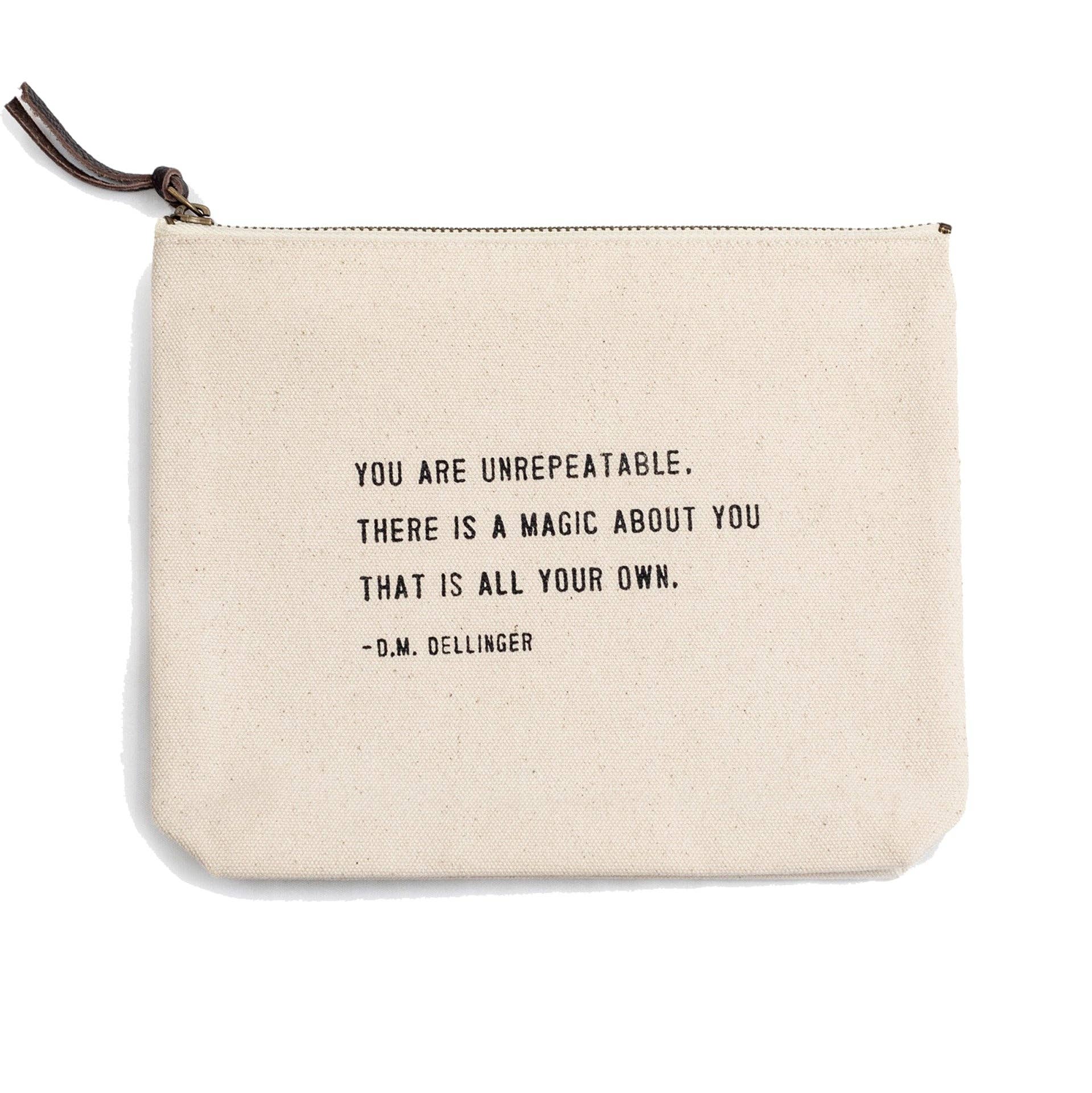 Beige pouch with motivational quote on a white background