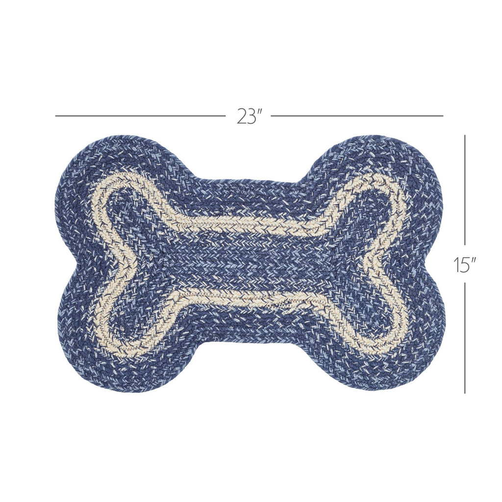 A bone-shaped braided rug in navy blue and cream, shown with dimension lines indicating 23 inches wide and 15 inches high on a white background.