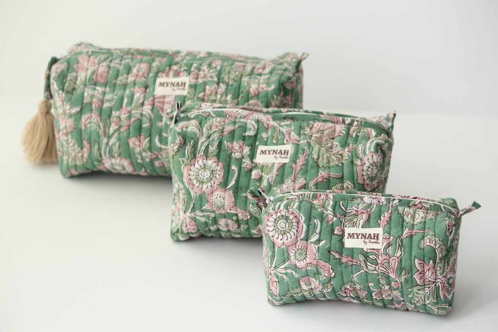 Set of three green floral-patterned bags with 'Myrah' branding on a light gray background