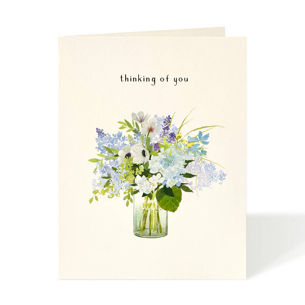 Greeting card with a floral illustration and 'thinking of you' text on a white background