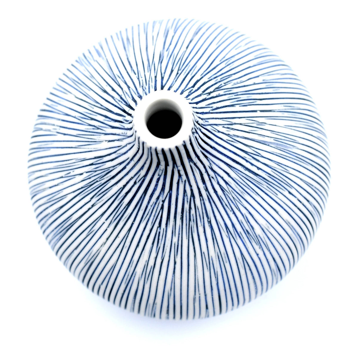 A round white ceramic vase with a narrow neck and a blue hand-painted radial line pattern, shown on a white background.
