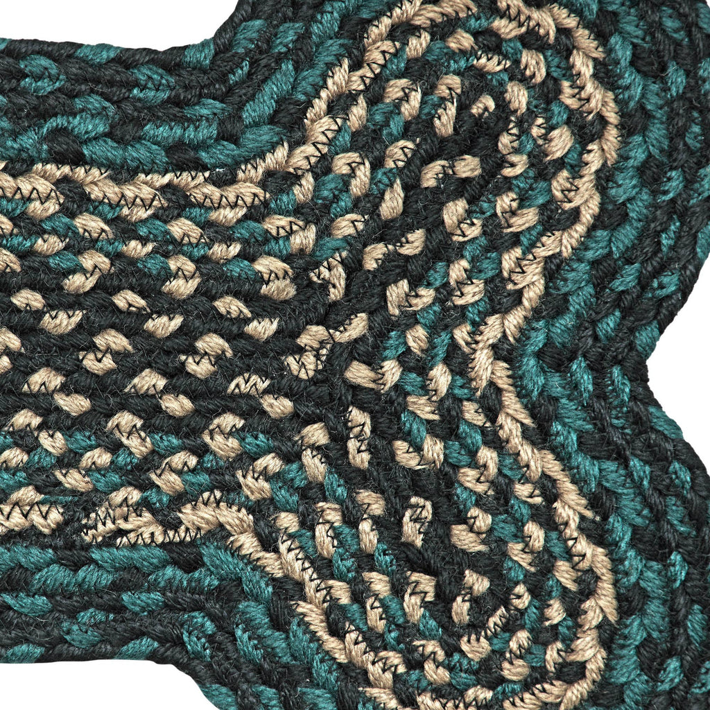 Close-up of a textured fabric with a wavy pattern in black, green, and beige.