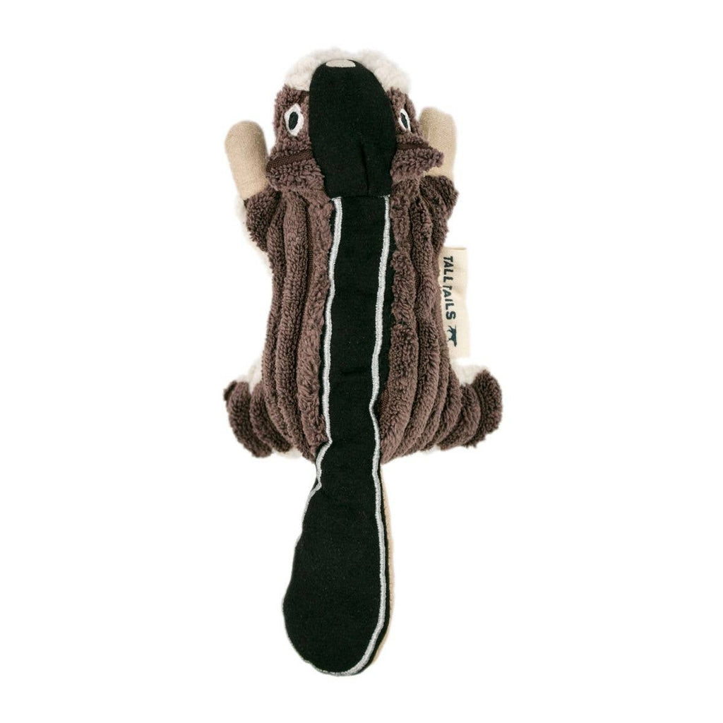 Dog toy resembling a skunk on a white background