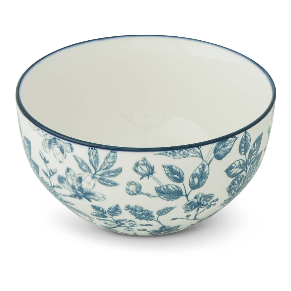 A white ceramic bowl with a blue floral toile pattern and a thin blue rim, shown on a clean white background.