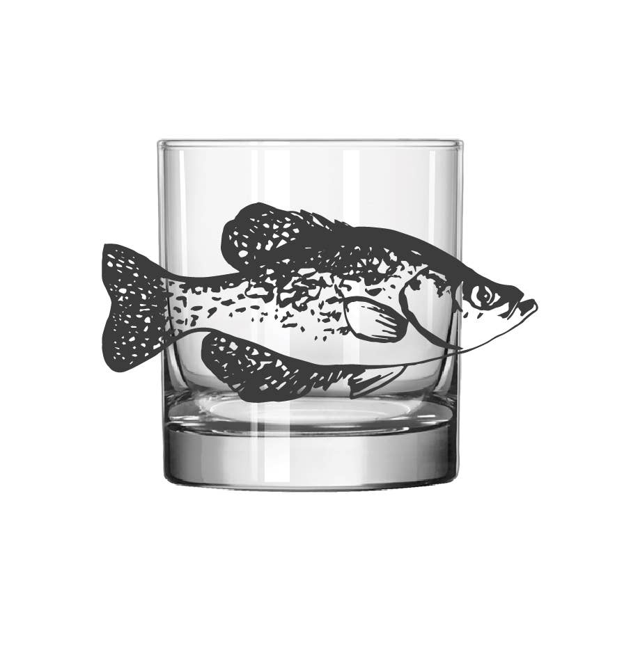 A clear glass rocks tumbler with a black fish silhouette printed on the side, shown against a plain white background.
