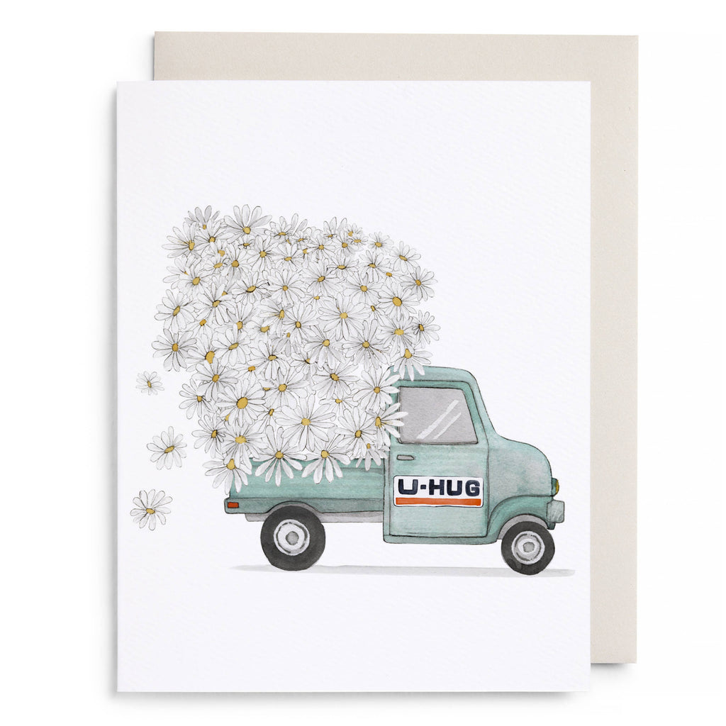 Card with a U-Haul truck carrying a large bouquet of daisies on a white background