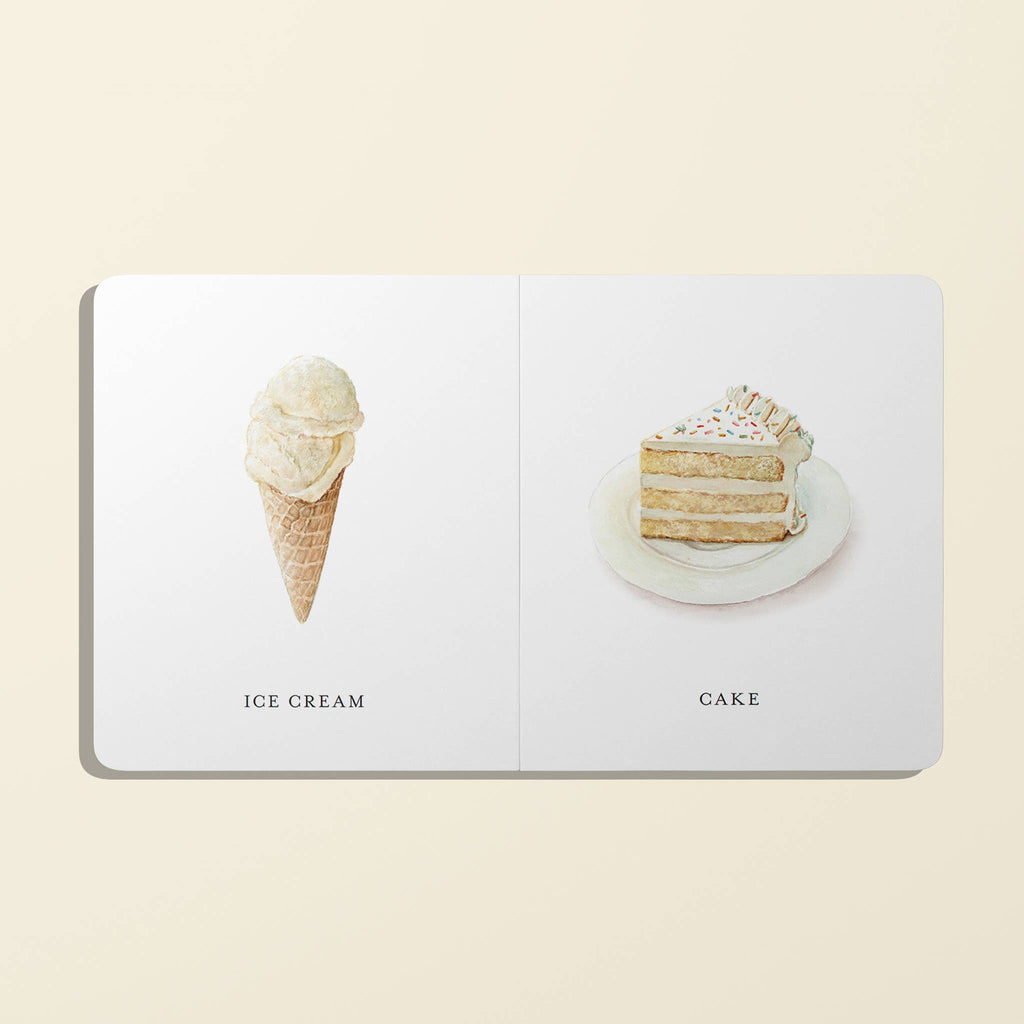 Open book with illustrations of ice cream and cake on a beige background