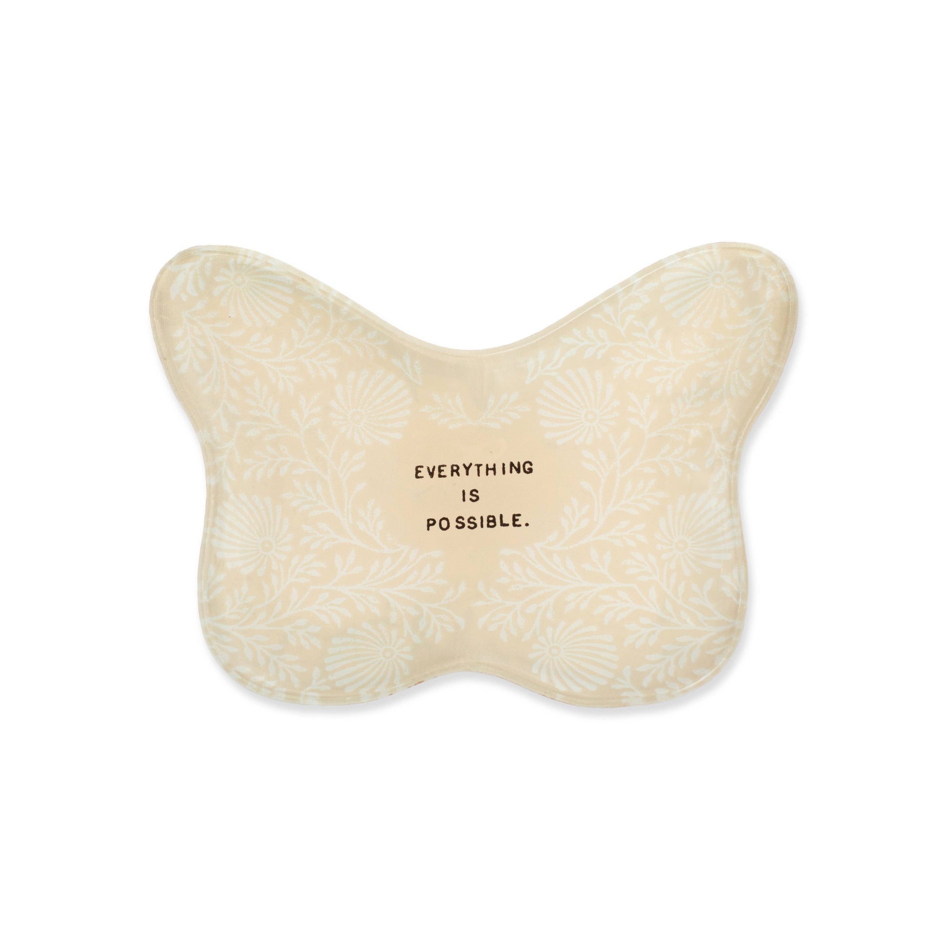 Butterfly-shaped pillow with 'Everything is possible' text on a white background