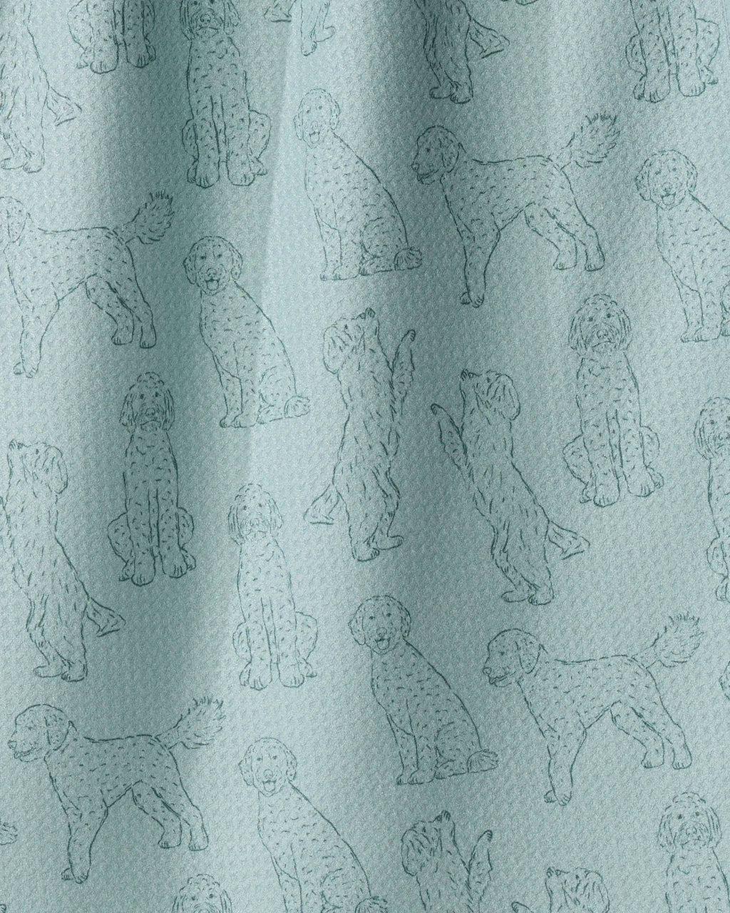 A close-up of a light blue fabric with an all-over repeating pattern of poodle illustrations in a slightly darker blue-gray outline.