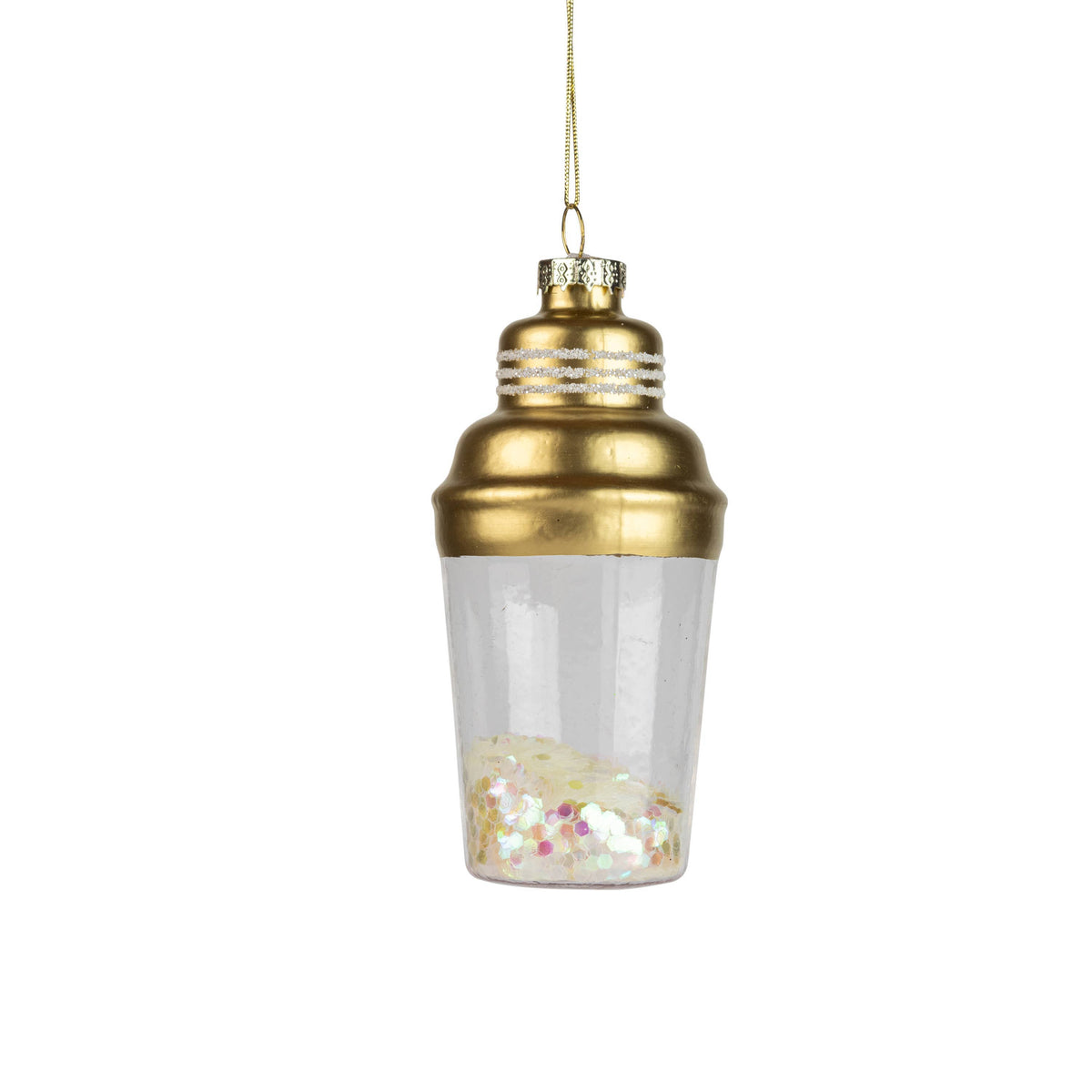 Gold and clear glass ornament with confetti on a white background