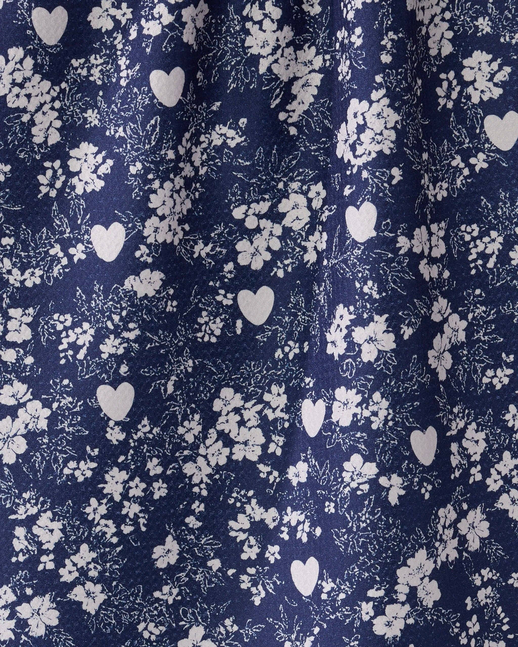Navy fabric with white floral and heart pattern