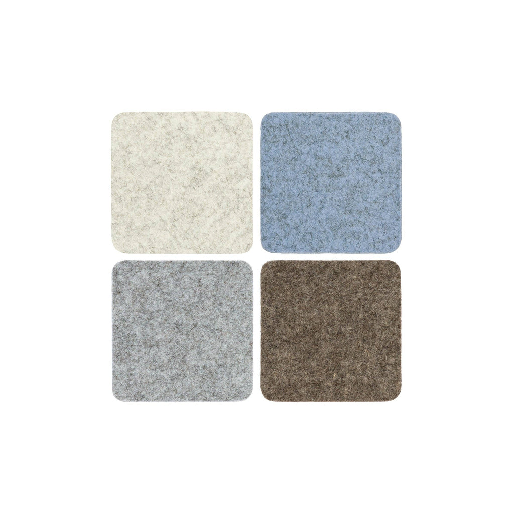 Four square samples of different textured fabric colors on a white background
