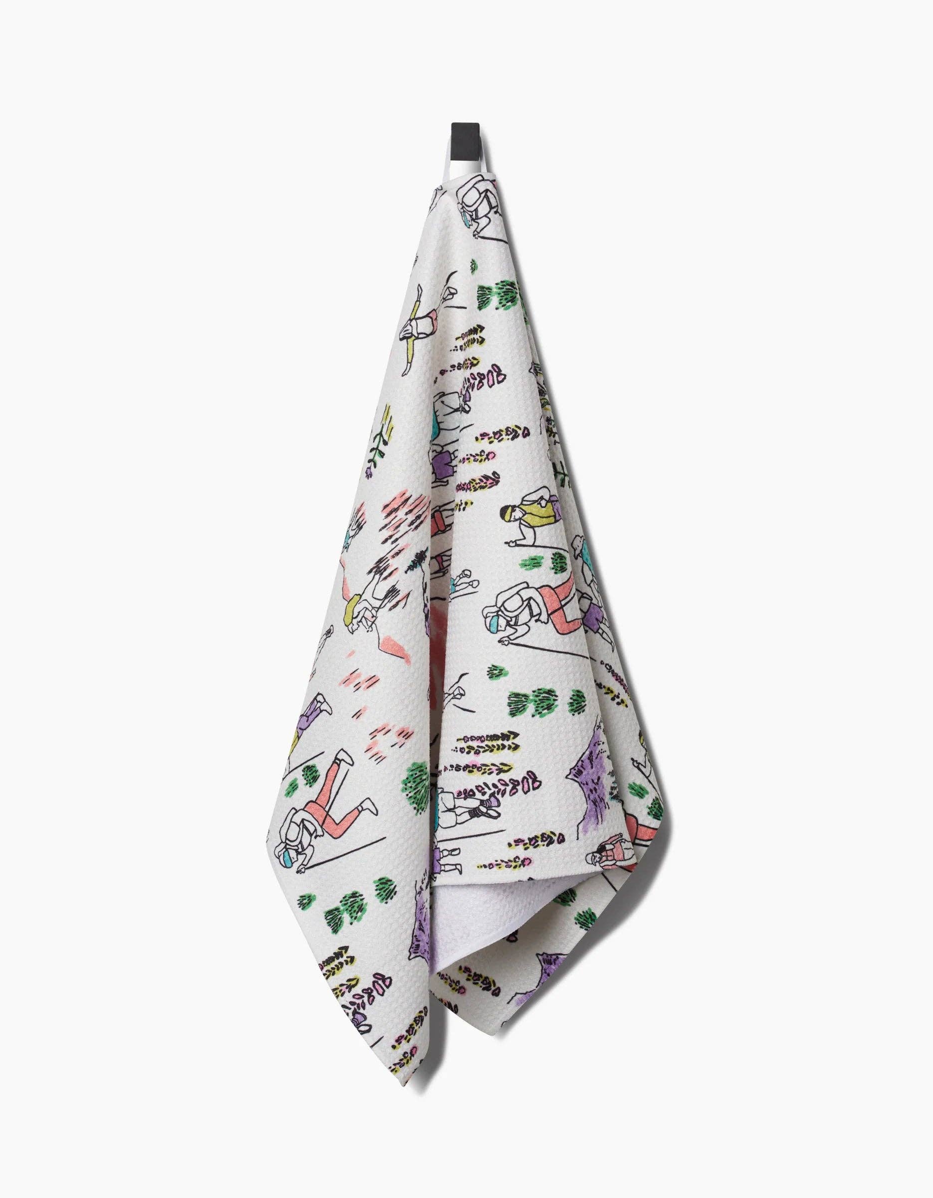 A multicolored tea towel with a character-based pattern design.