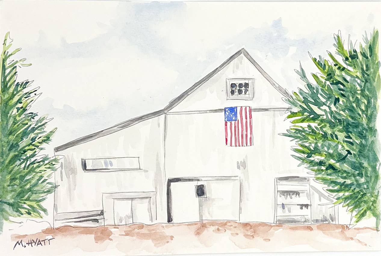 Watercolor painting of a white barn with an American flag hanging on the front, green trees on both sides, and a pale sky above.