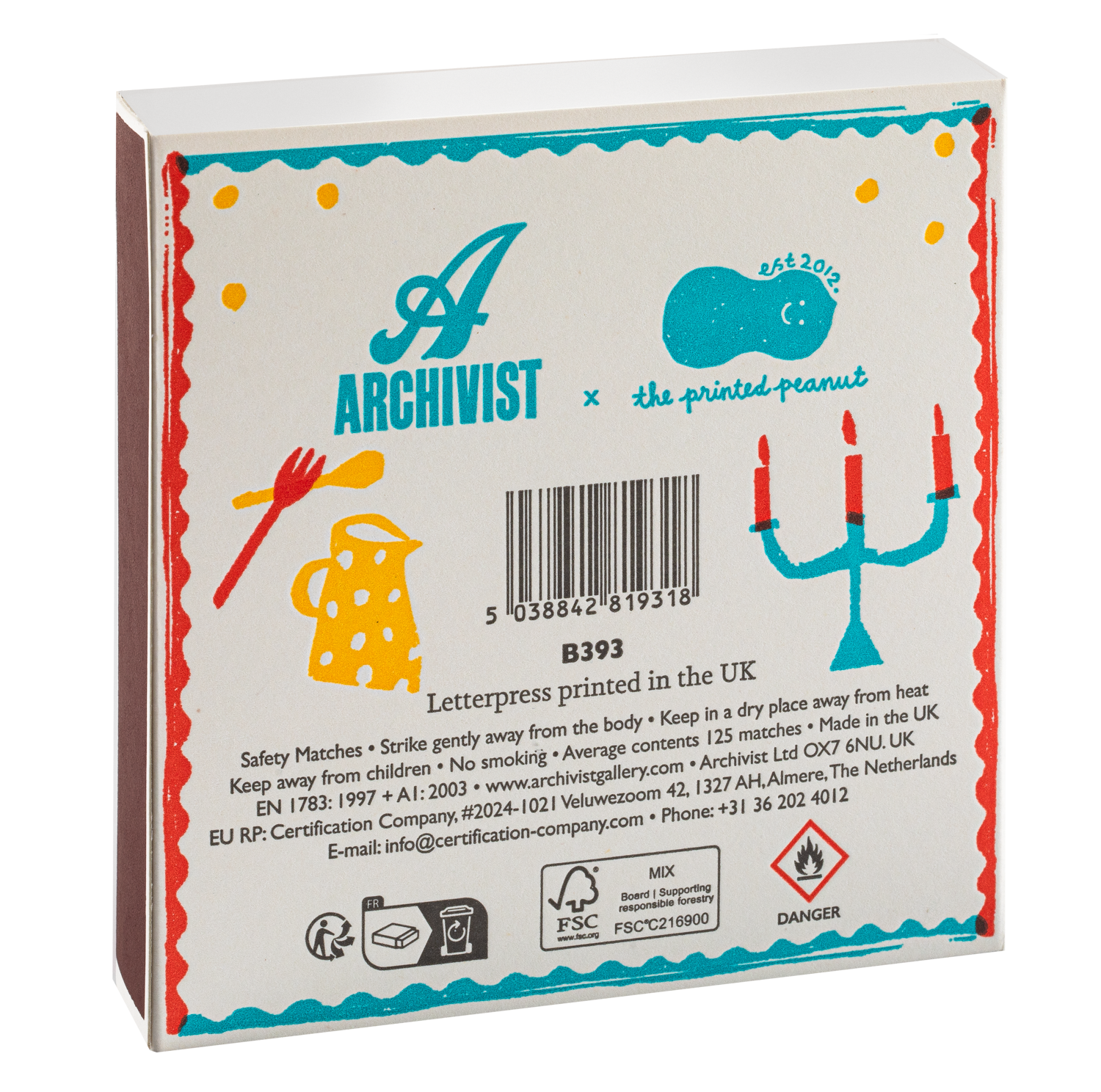 The back of a white Archivist x The Printed Peanut letterpress box, featuring colorful illustrations of a candelabra, a yellow polka-dot hat, and safety information, photographed on a white background.