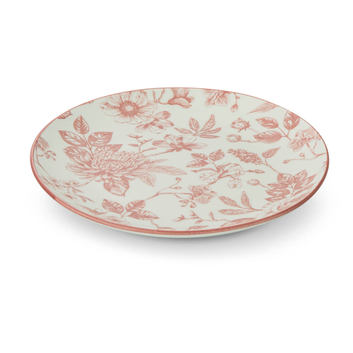An oval ceramic plate with a dusty rose floral toile pattern on a warm cream background, shown from a high angle on a white background.