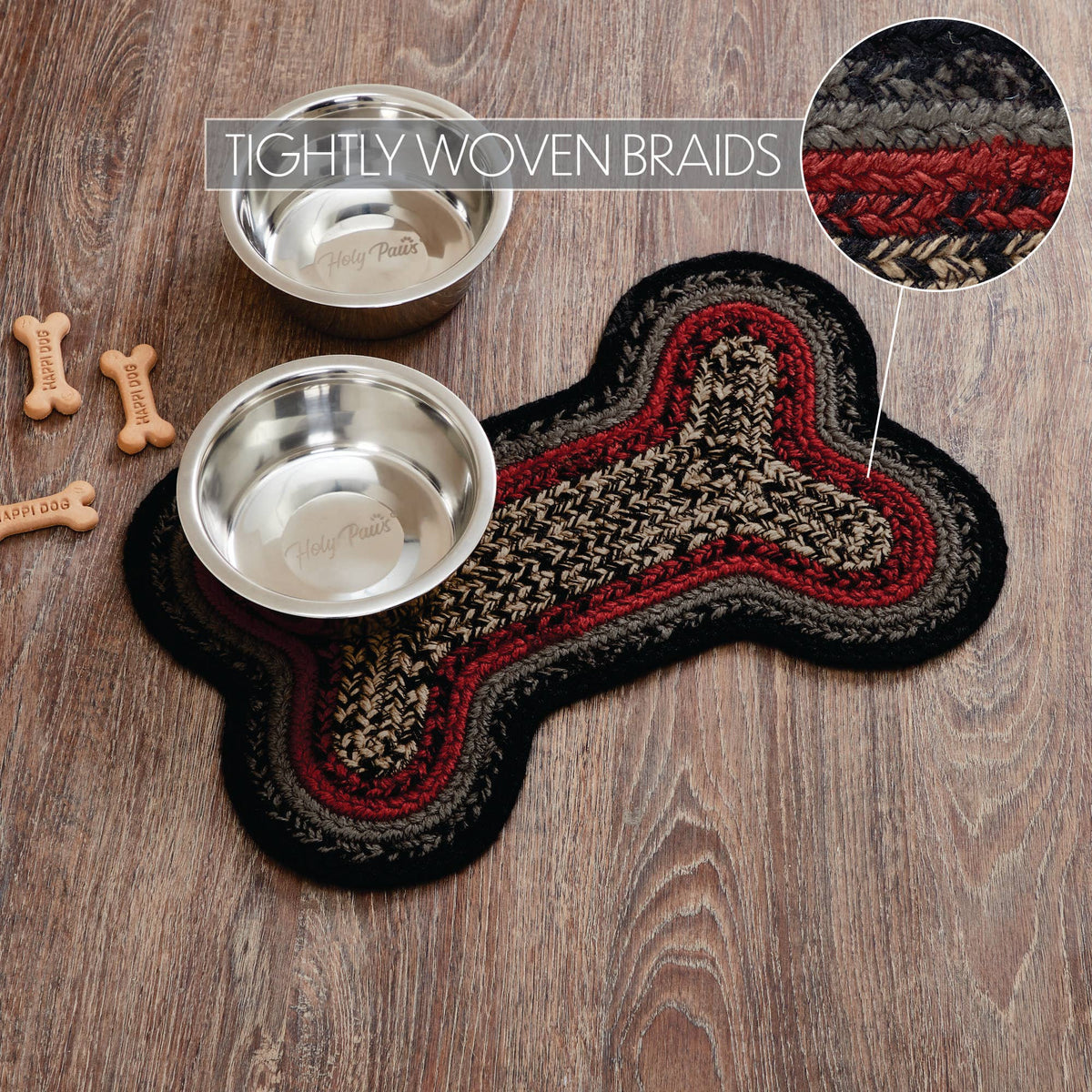 Dog bone-shaped mat with two metal bowls on a wooden surface, featuring tightly woven braids.