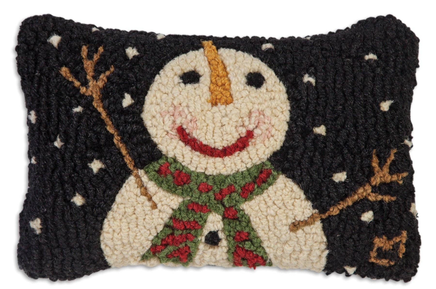 A rectangular hand-hooked wool rug featuring a smiling snowman with a green and red patterned scarf, set against a dark black background with white snowflakes.