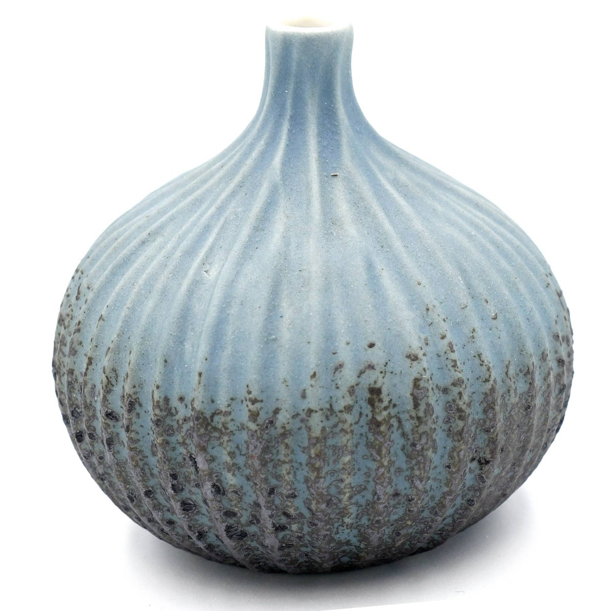 A small bulb-shaped ceramic vase with a narrow neck and vertical ribbed texture, featuring a light blue to gray glaze with darker mottled brown and gray areas concentrated toward the base, shown on a white background.