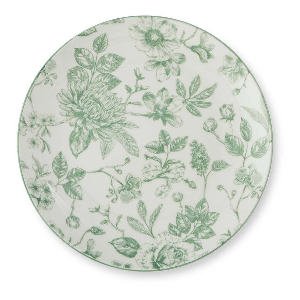A round white ceramic plate featuring an elegant green botanical floral pattern, photographed from directly above on a clean white background.