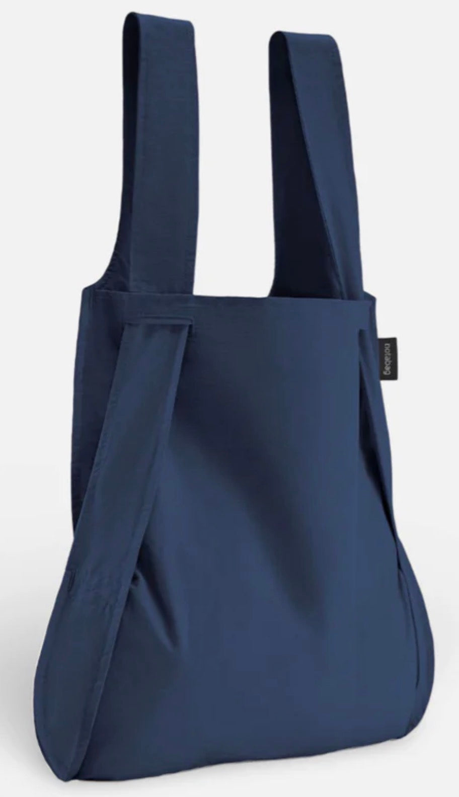 A navy blue reusable tote bag with wide shoulder straps, shown on a clean white background.