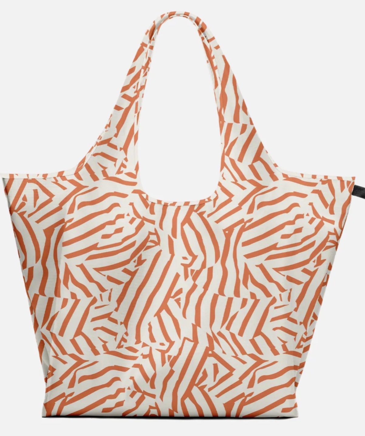 A reusable tote bag with a bold orange and off-white abstract wavy pattern, shown against a plain light gray background.