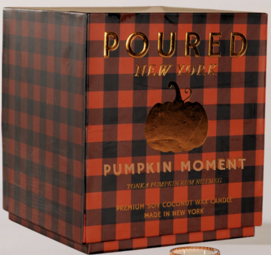 Poured New York 'Pumpkin Moment' tonka pumpkin rum ruming premium soy coconut wax candle in a red and black buffalo plaid box with gold lettering and a pumpkin cutout.