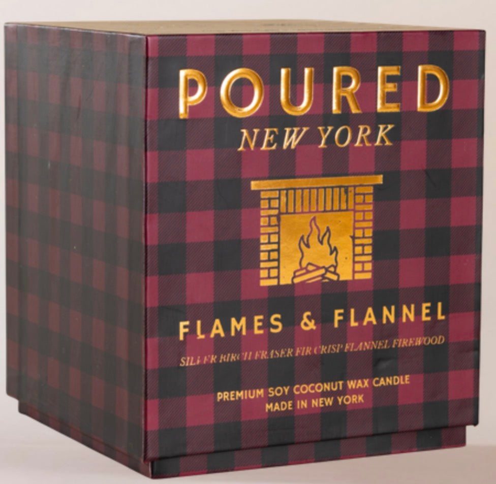 Poured New York Flames & Flannel candle packaging box featuring a red and black buffalo plaid pattern with gold foil lettering and a fireplace graphic.