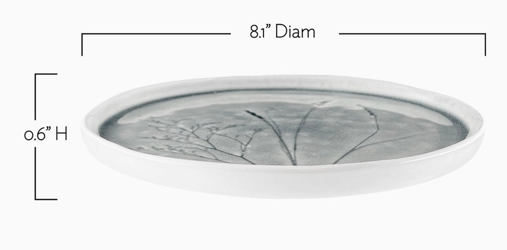 A shallow oval ceramic tray with a gray and white leaf pattern, shown with dimension lines indicating an 8.1-inch diameter and 0.