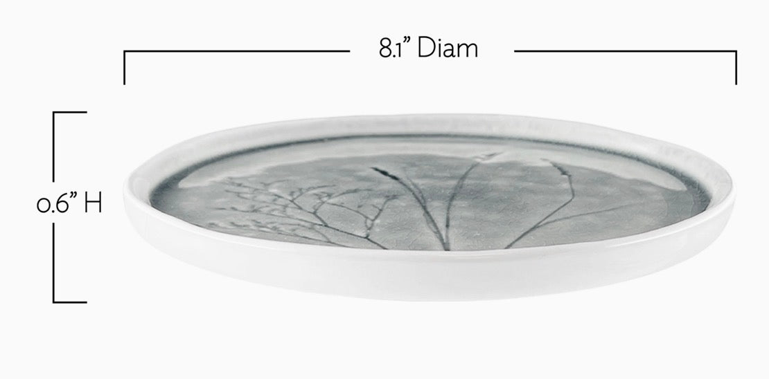 A shallow oval ceramic tray with a gray and white leaf pattern, shown with dimension lines indicating an 8.1-inch diameter and 0.