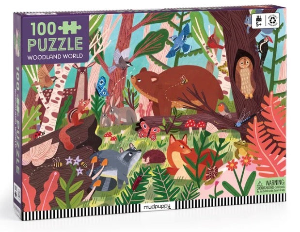A 100-piece woodland-themed jigsaw puzzle box by MudPuppy, featuring a colorful, detailed illustration of forest animals including a bear, owl, fox, deer, and birds among foliage.