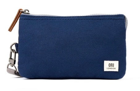 A navy blue canvas zip pouch with a small white 'ORI LONDON' label on the front and a brown leather zipper pull, shown on a plain white background.