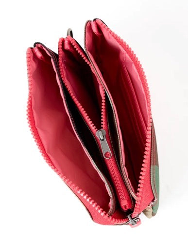An open zippered pouch or coin purse with a bright pink interior and a red, green, and beige plaid exterior, shown on a white background.
