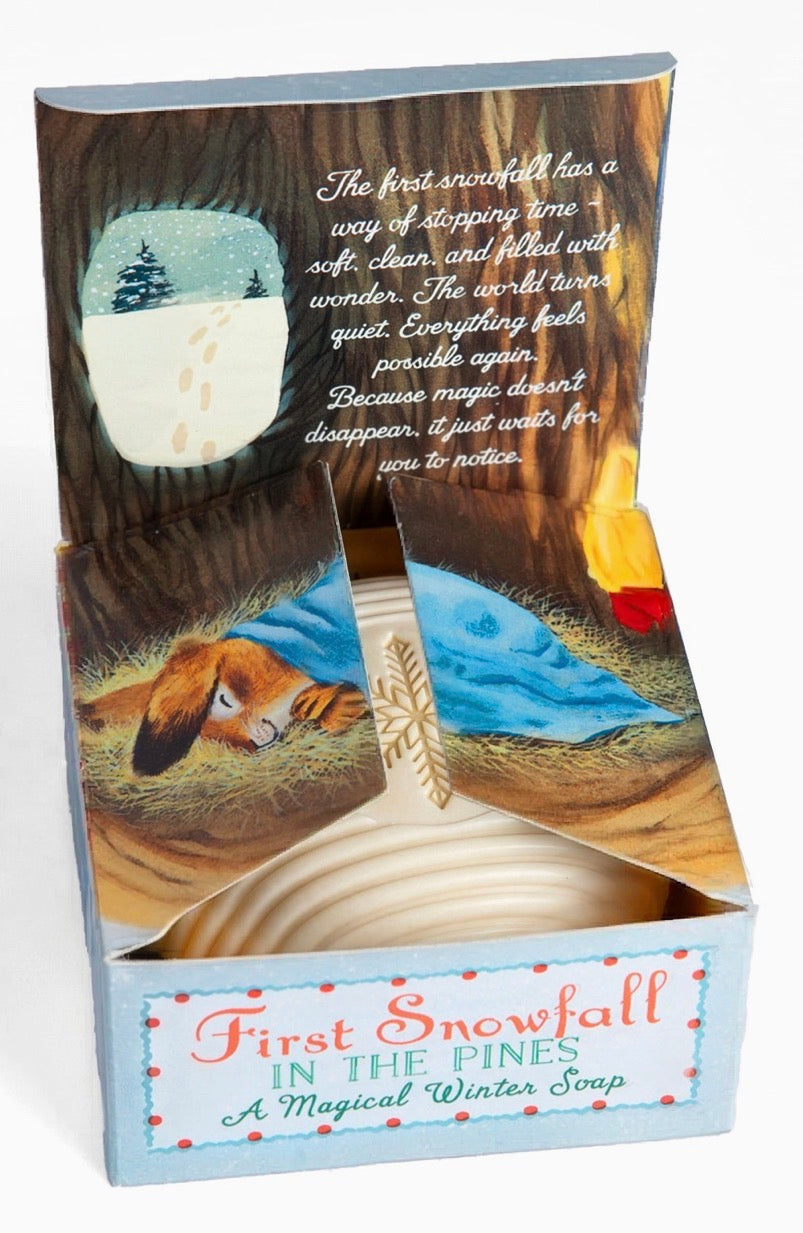 A boxed winter-themed soap product labeled 'First Snowfall in the Pines' with illustrated forest and pine imagery on the packaging.