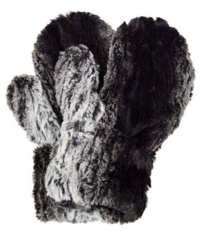 A pair of plush faux-fur mittens in black and gray, shown against a plain white background.