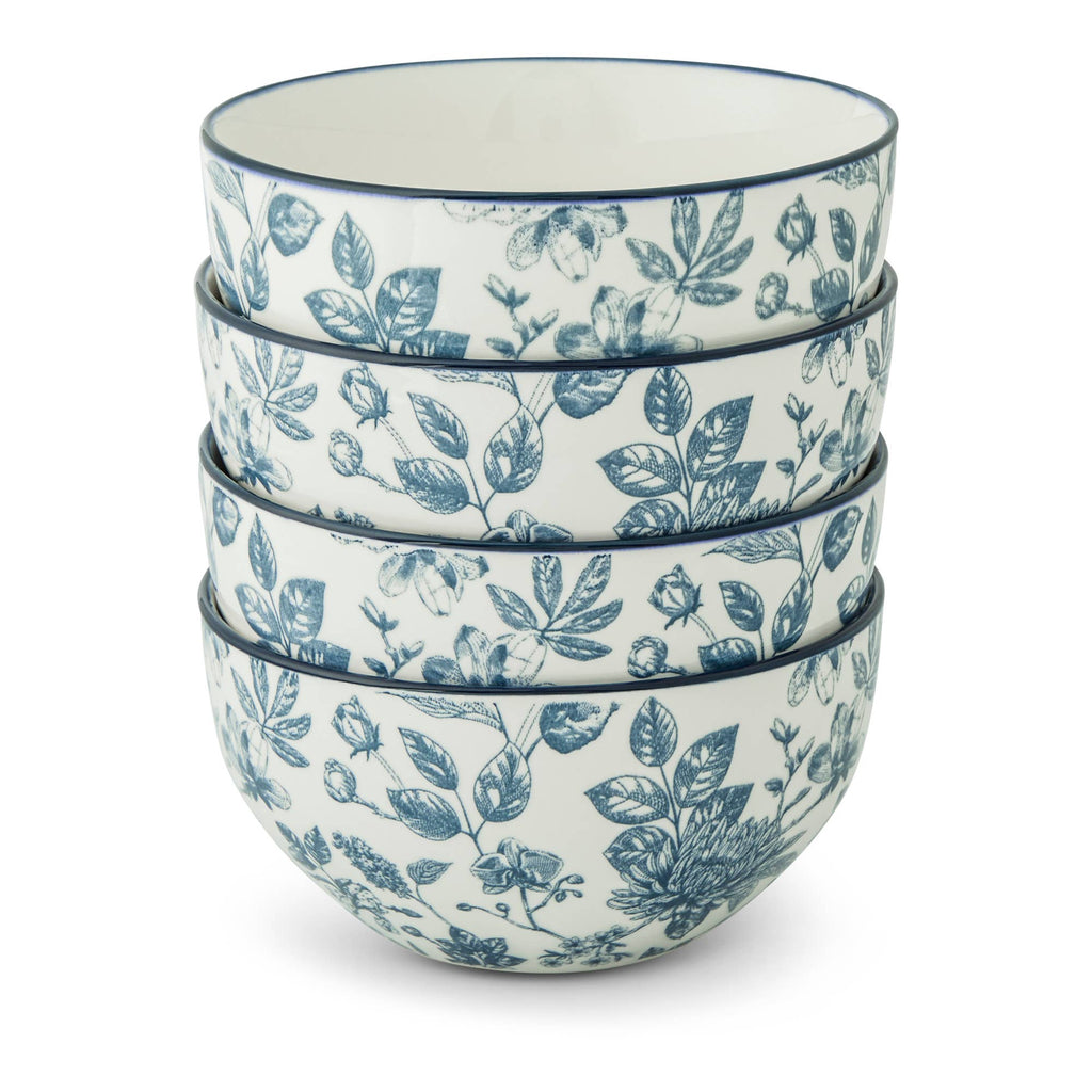 Four stacked ceramic bowls with a blue floral toile pattern on a white background, photographed on a clean white studio background.