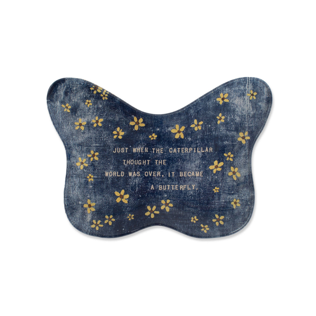 Denim butterfly-shaped cushion with yellow flowers and a motivational quote on a white background