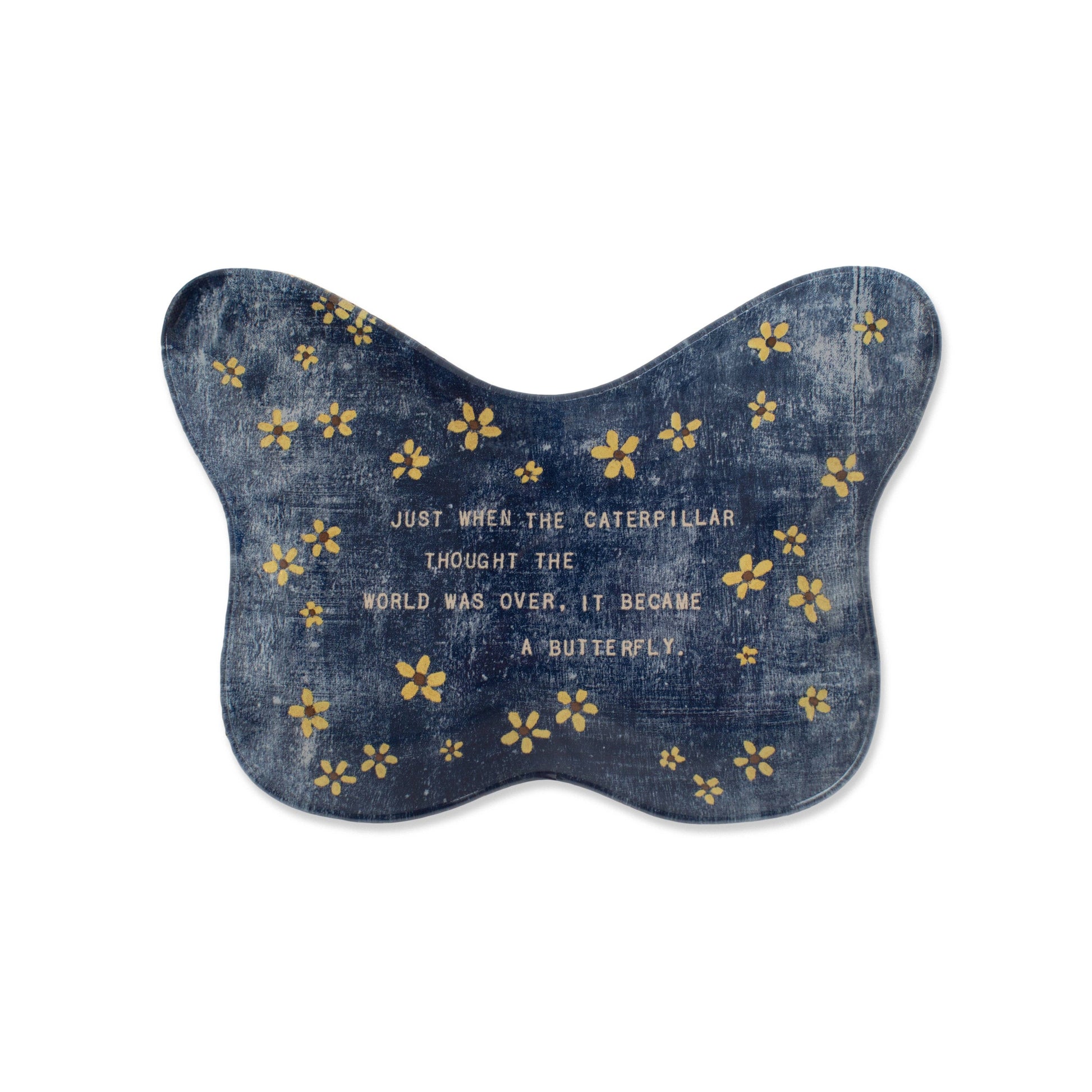 Denim butterfly-shaped cushion with yellow flowers and a motivational quote on a white background