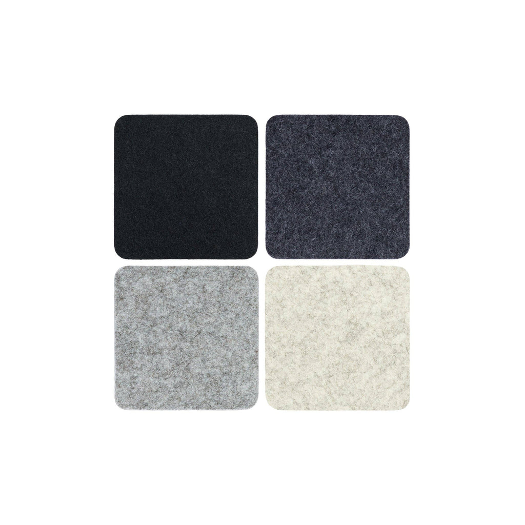 Four square samples of different textured fabrics on a white background