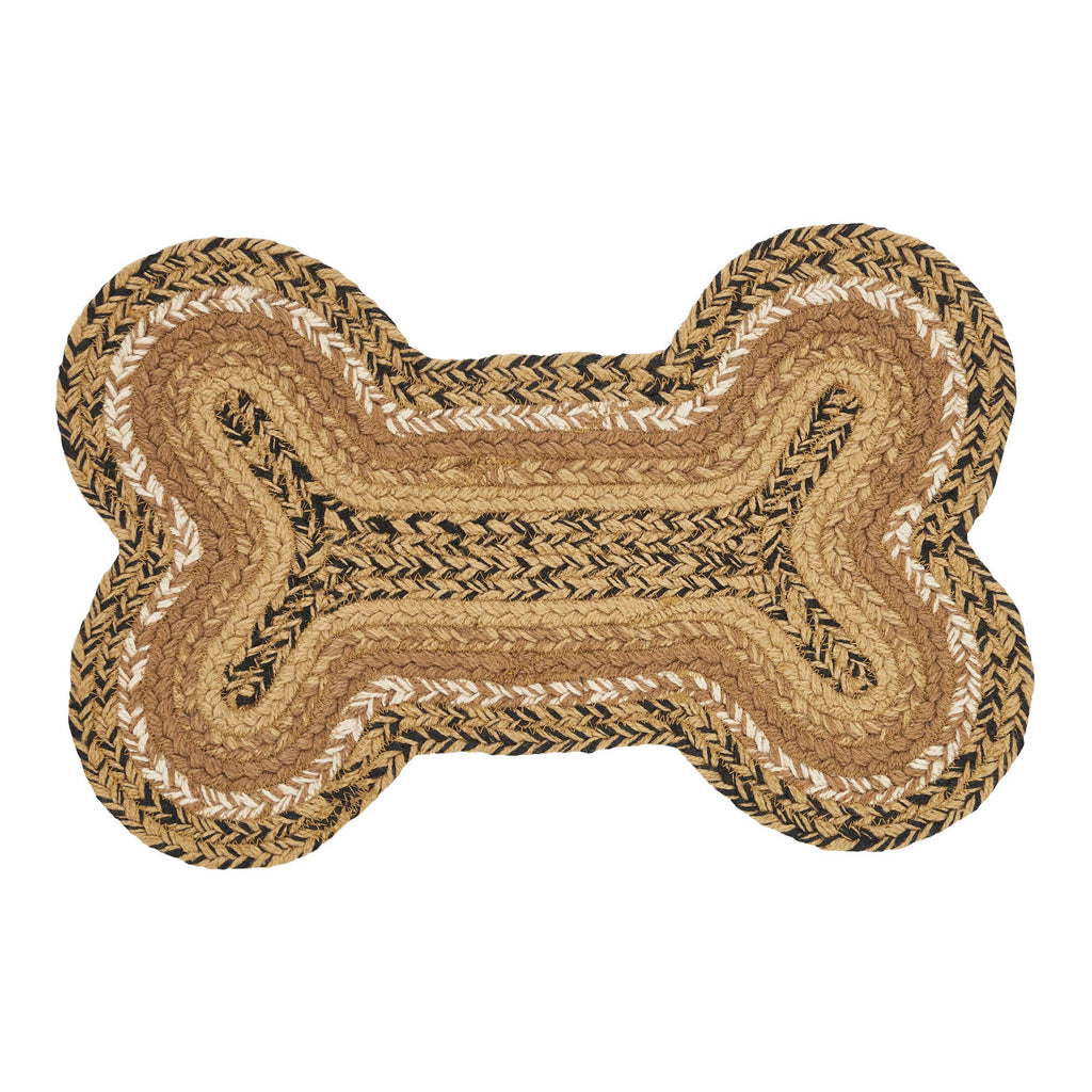 A braided bone-shaped rug in natural tan, beige, and black tones, shown flat against a solid white background.