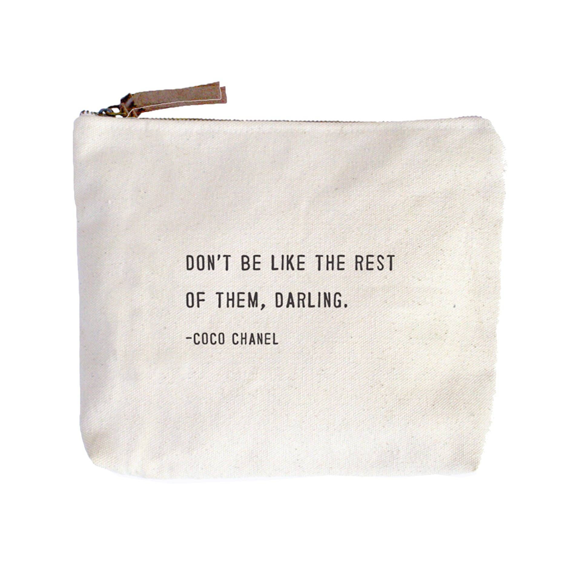 Beige pouch with black text quote on a white background