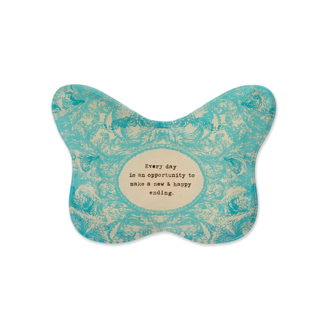 Turquoise butterfly-shaped decorative item with a motivational quote on a white background