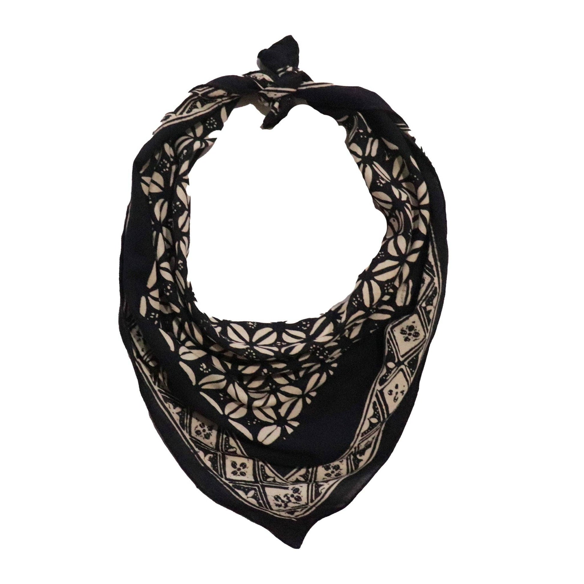 Black and beige patterned scarf on a white background