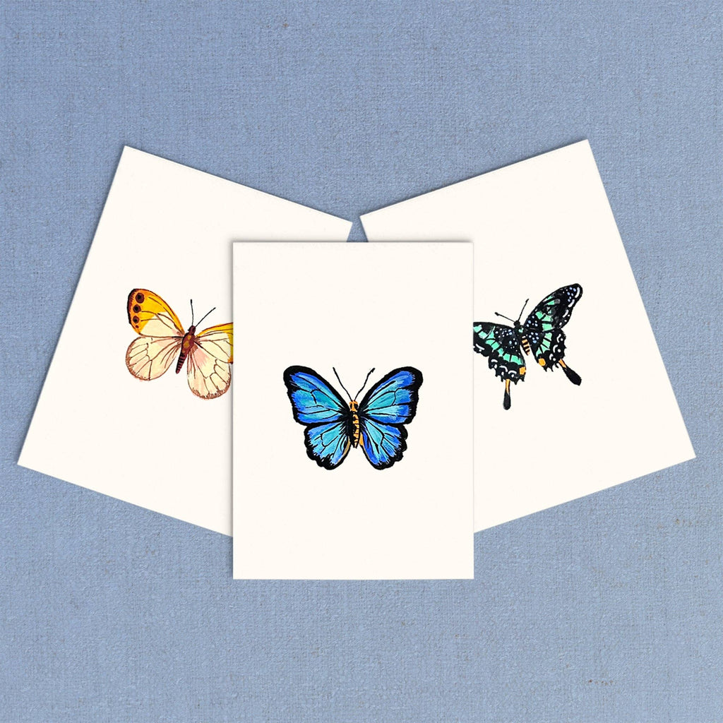Three butterfly illustrations on a white card with a blue background