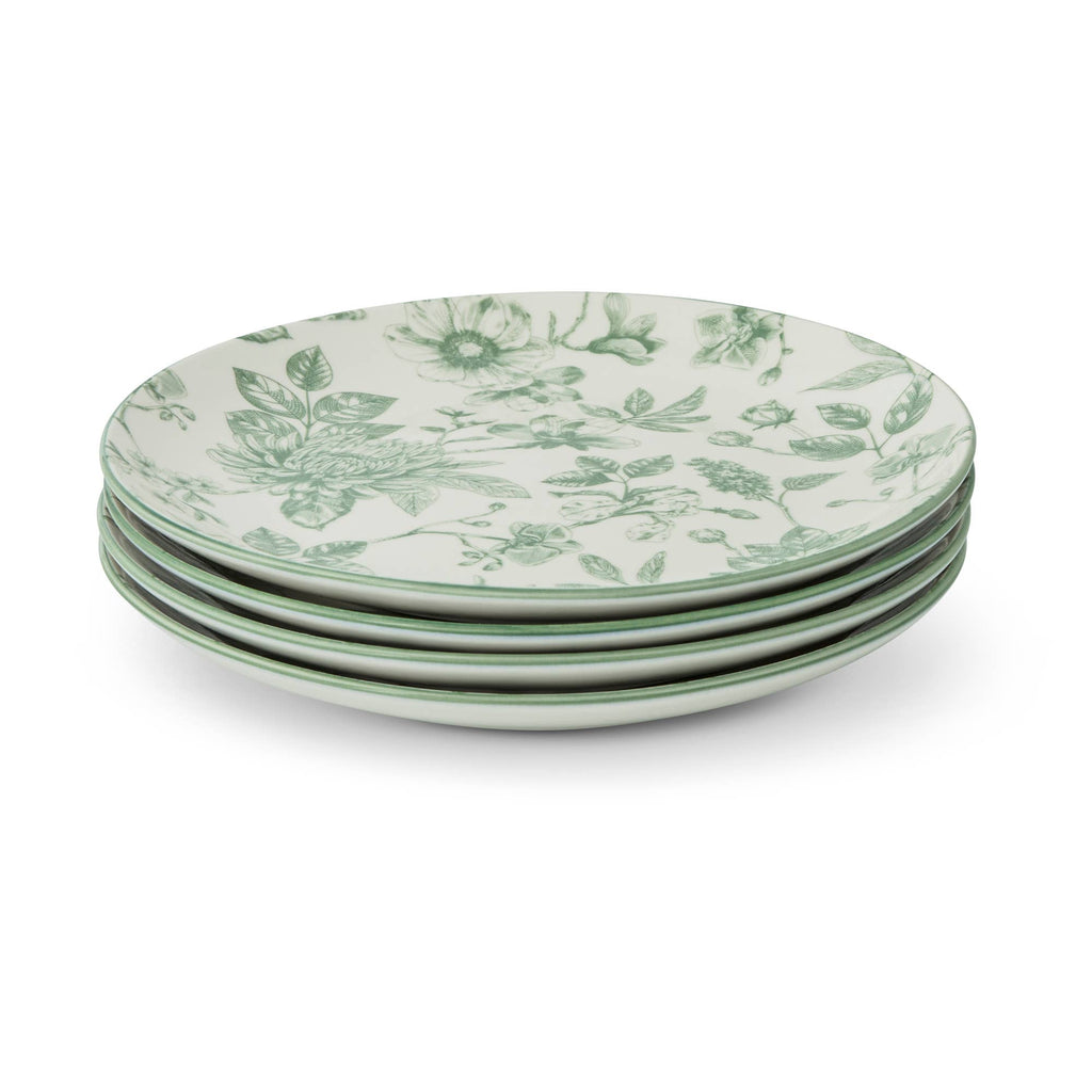 A stack of five round ceramic plates with a green floral toile pattern on a white background, photographed on a clean white studio background.