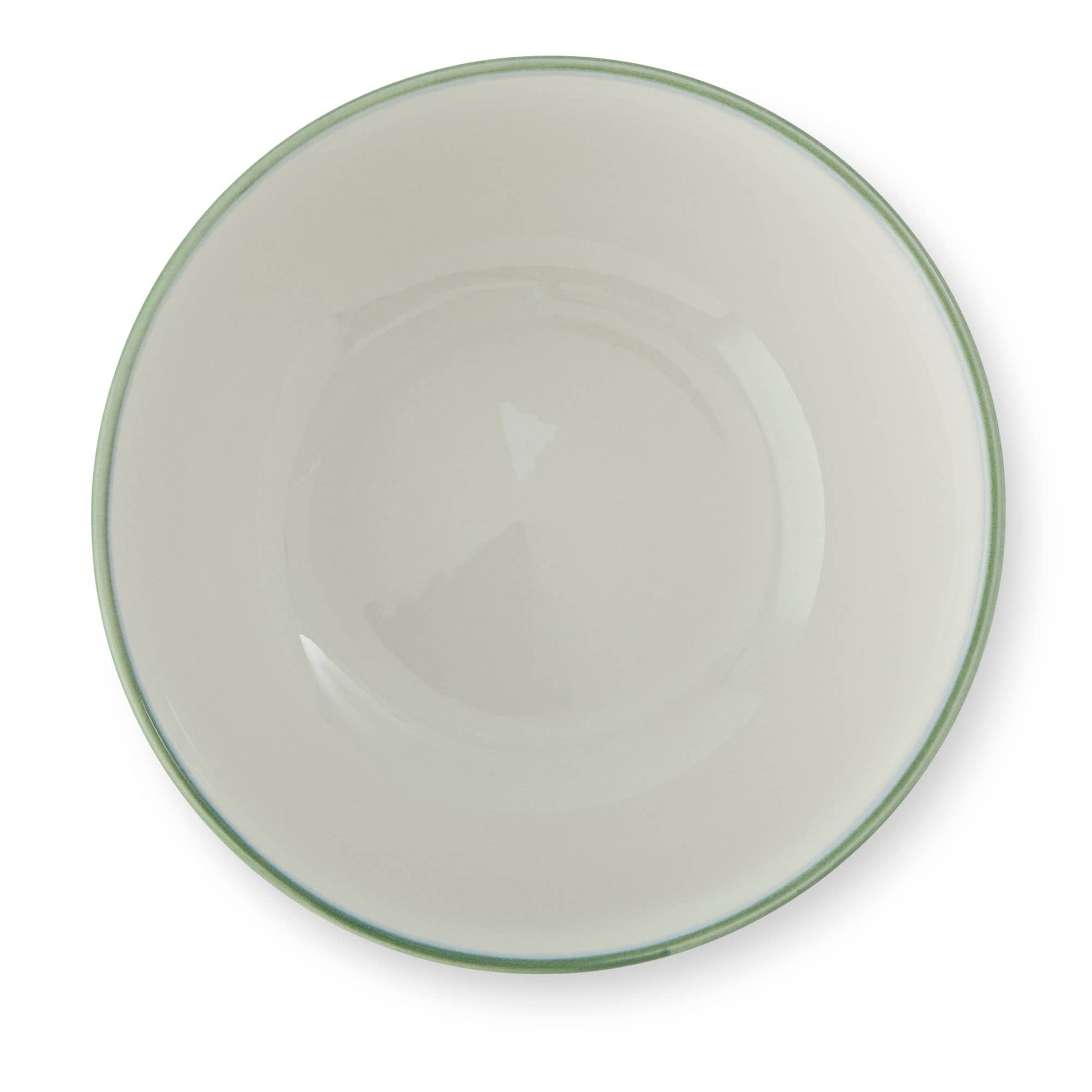 White ceramic bowl with a green rim on a white background