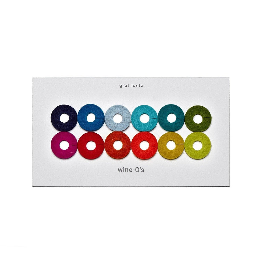 A white card displaying 12 circular felt wine glass color swatches arranged in two rows, labeled 'graf lantz' at the top and 'wine-O's' at the bottom.