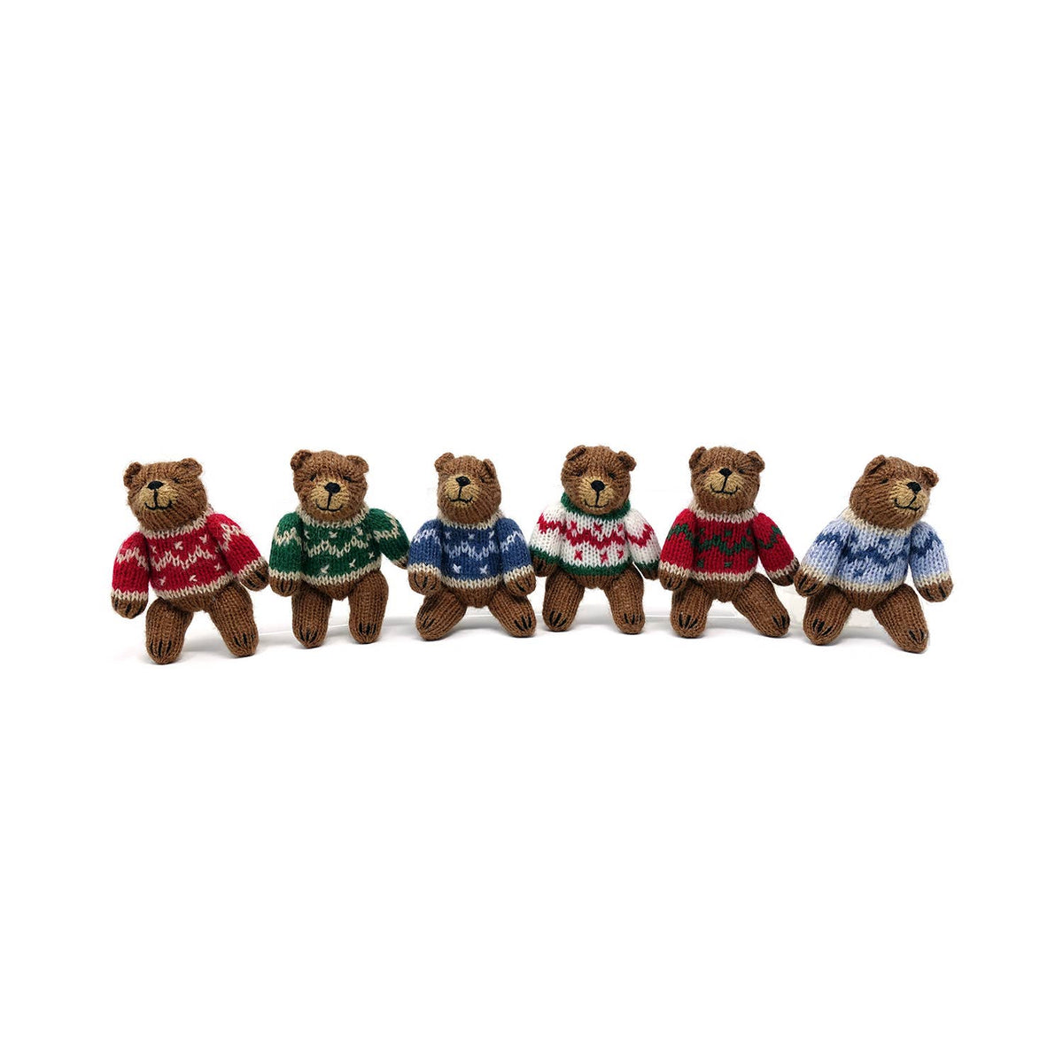 Six small teddy bears wearing colorful sweaters on a white background